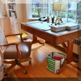 F30. Leather top trestle desk. 31”h x 55”w x 32”d and F31. Sam Moore Furniture for La-Z-Boy leather nailhead desk chair. 39”h x 25”w x 22”d 